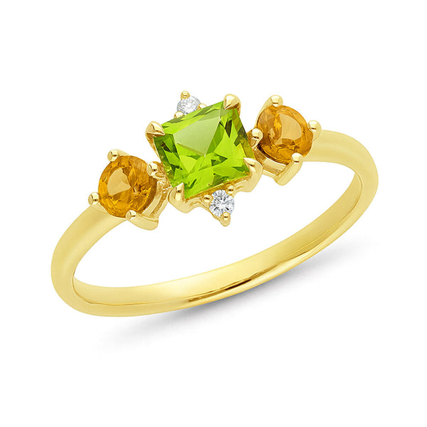 Gold ring with peridot green gemstone and two orange citrine gemstones on a white background