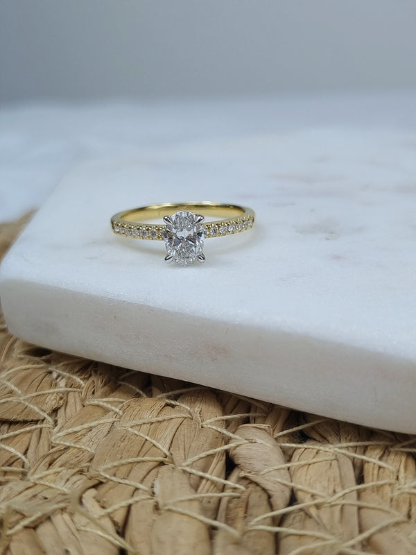 18ct Yellow and White gold Oval engagement ring, 0.72ct centre