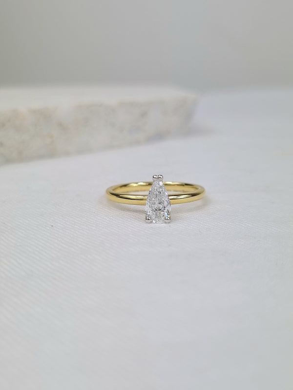 18ct Yellow and White gold Pear engagement ring, 0.71ct centre