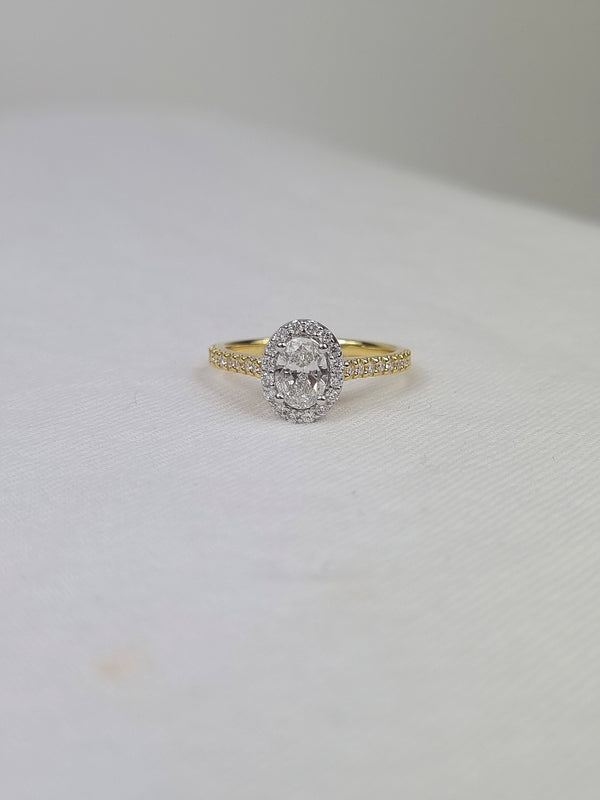 18ct Yellow and White Gold Oval Halo Engagement Ring, 0.56ct centre